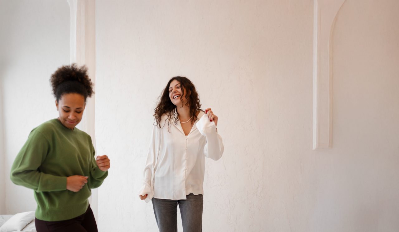 Two women smiling together at home